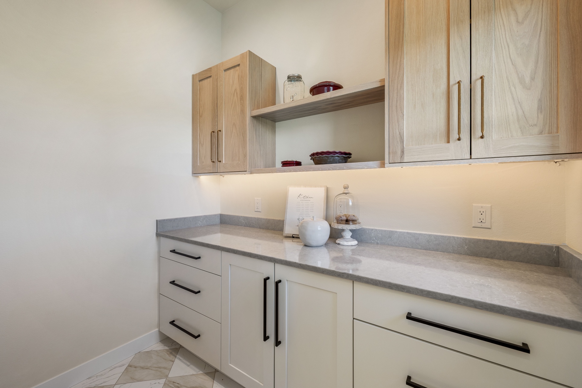 Boutique-style custom primary closet with built-in shelving