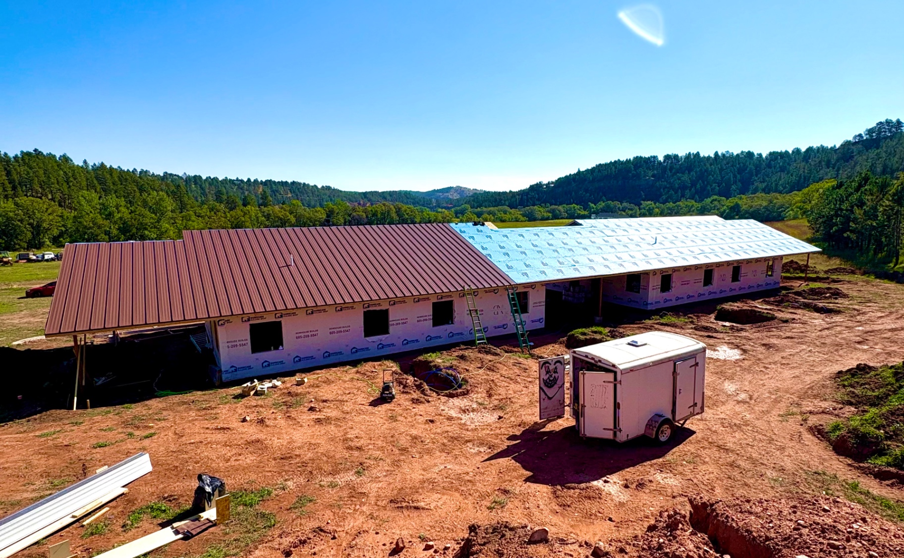 Aerial view of a project under construction showing framing and site layout